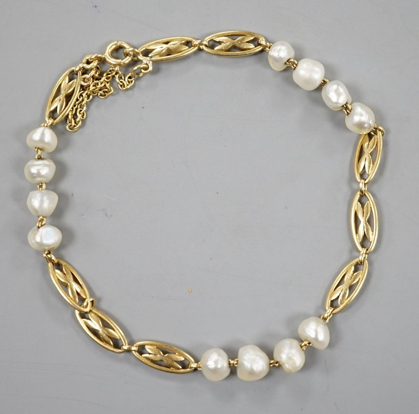 A yellow metal and baroque pearl set fancy link bracelet, 18cm